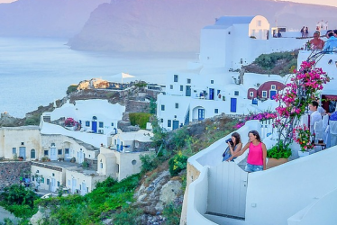 Santorini village whitewashed houses with Aegean Sea, Greece